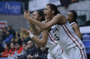Lauren Betts gives a gold medal cheer for her U16 national teammates.