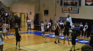 Caleb McGill (#2) dunking against Arapahoe.
