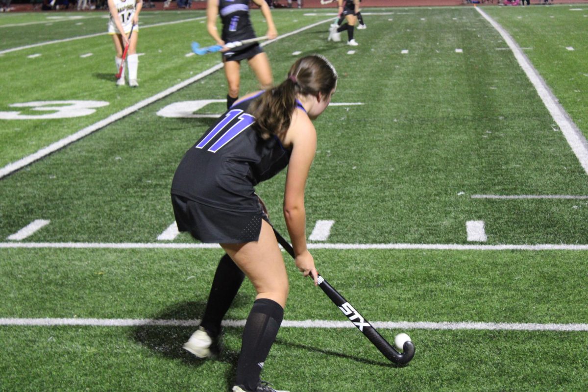 Laurel Caranta(12) enters the ball in the game for her team.