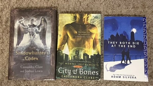 The following dystopia masterpieces: The Shadowhunters Codex by Cassandra Clare and Joshua Lewis, The Mortal Instruments: The City of Bones also by Cassandra Clare, and They Both Die at the End by Adam Silvera