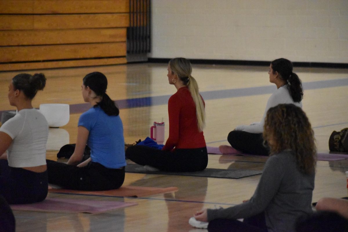 Students get ready for a night filled with relaxation by breathing in and out.