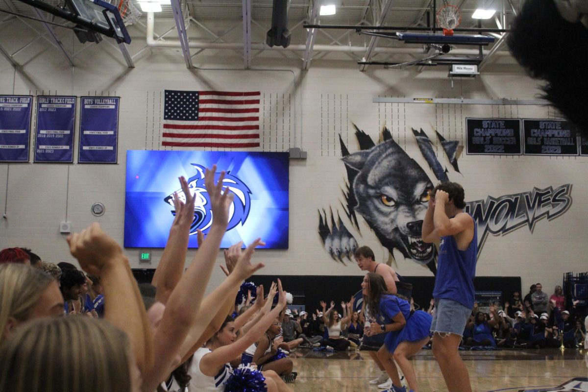 Grandview students showing their support for their school by doing the roller coaster led by Senior Emma Cary.