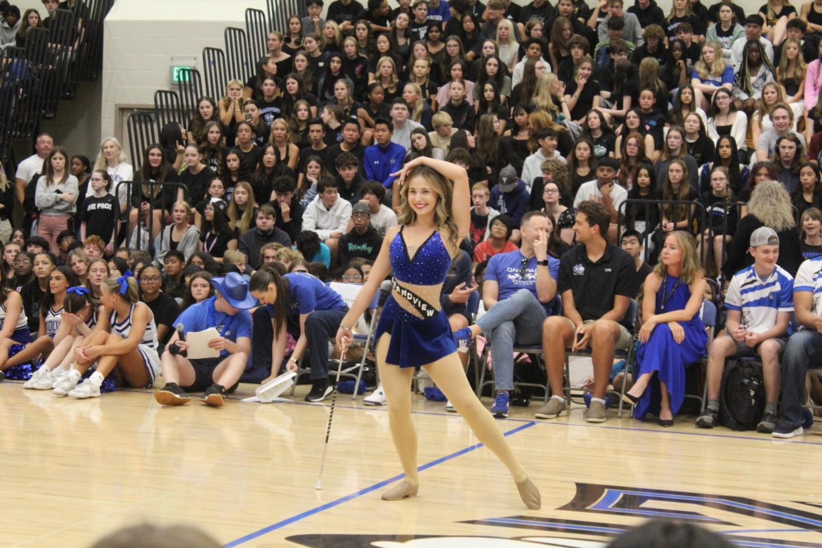 Senior Alyssa Brewer, infamous baton twirler, showcases her talent at the Pep Rally.