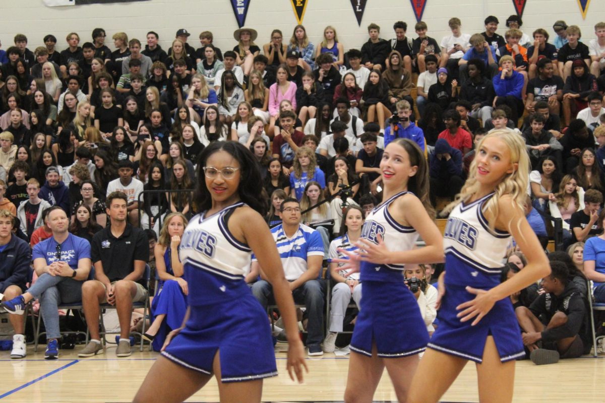 Brielle Thomas, Ella Wehrenberg, and Morgan Mayer performing their dance with the Grandview Poms team.