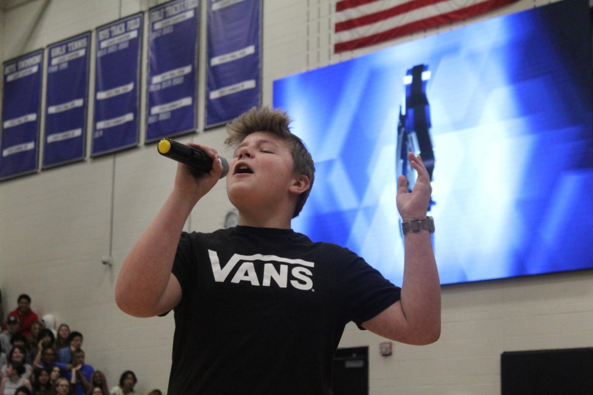 Freshman representative sings"Breaking Free" from High School Musical at the Pep Assembly.