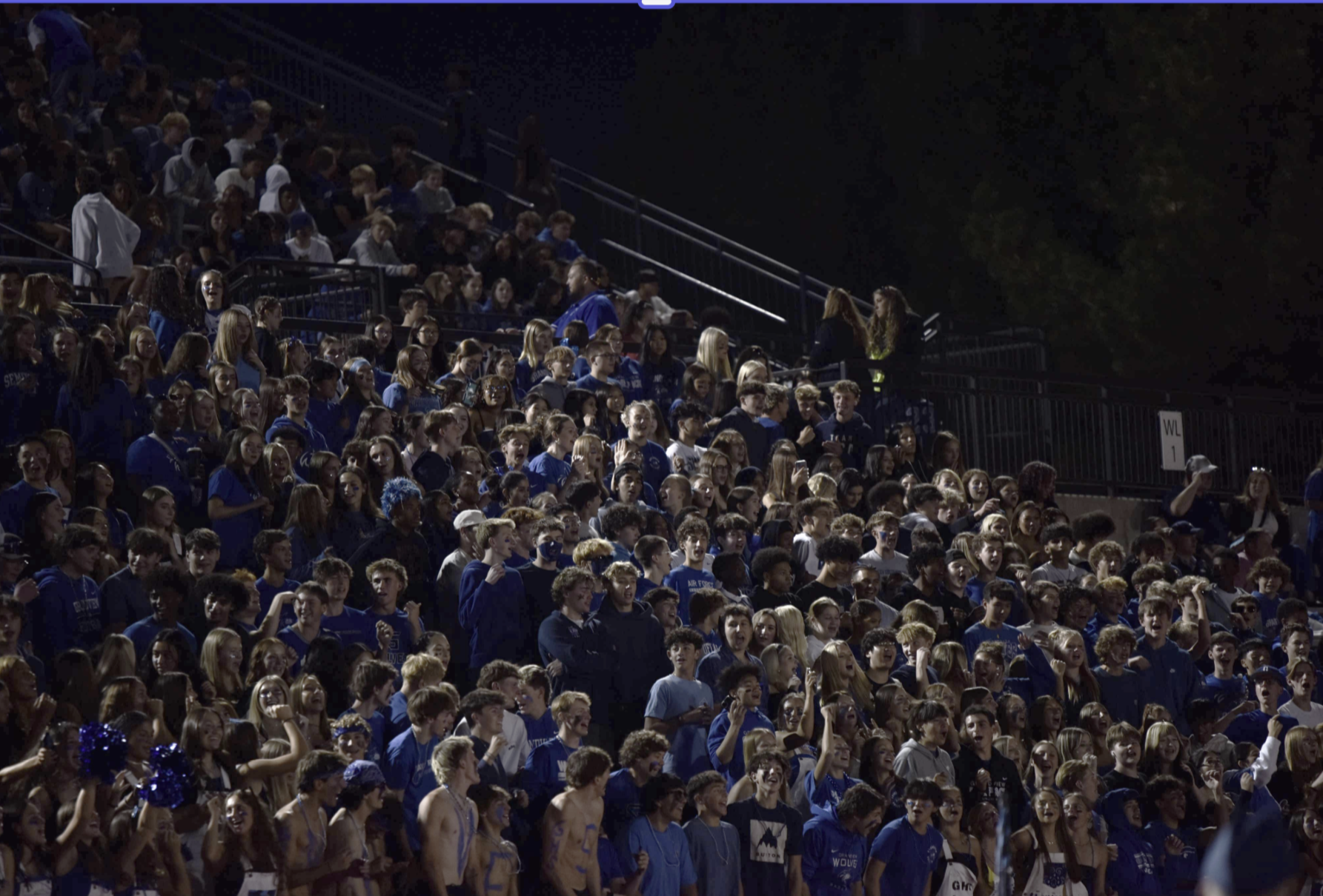 Grandview crowd flooding the stands with their school colors. They cheer for their varsity football team playing against Vista Peak, winning 42-7. 