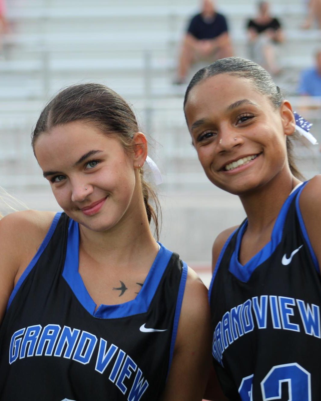 Caitlin Mitchell (right) (11) poses for photo during a field hockey game on 8/28 against Arapahoe. 