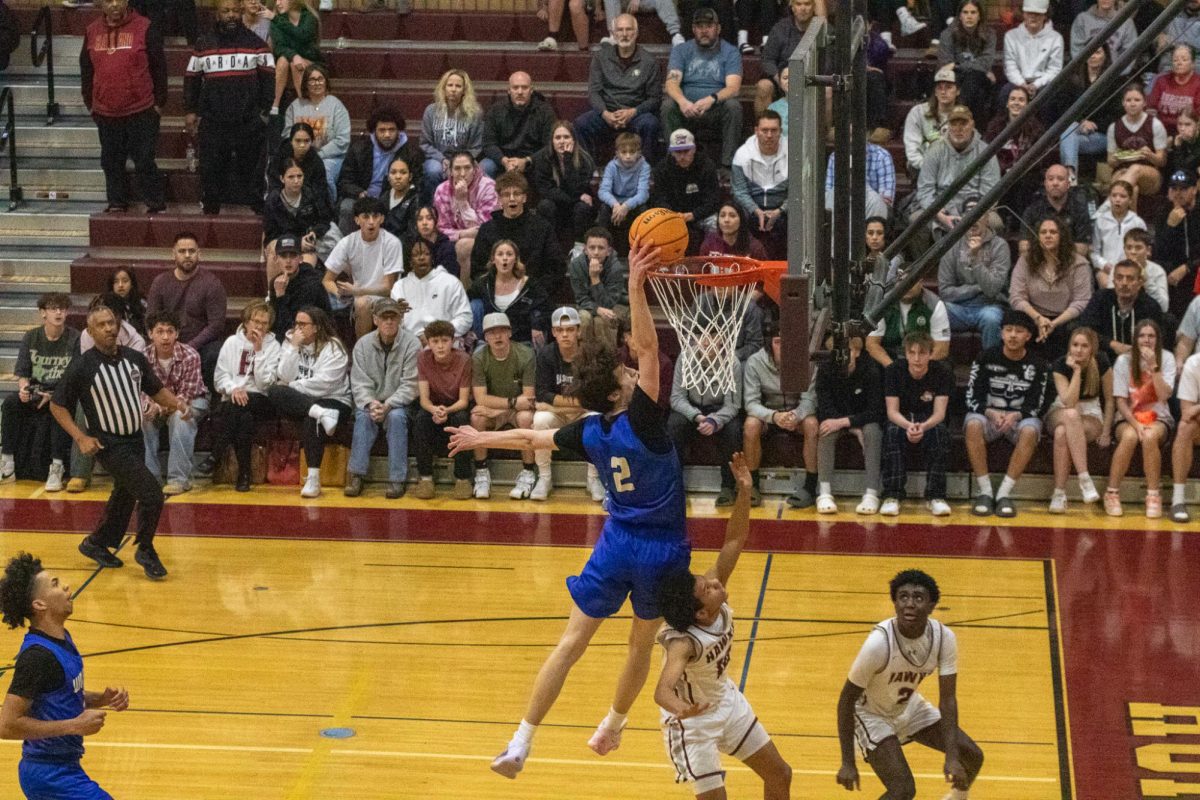 Noah Sevy (11) goes in for a dunk against Horizon High School at Horizon in playoffs on February 28th. 