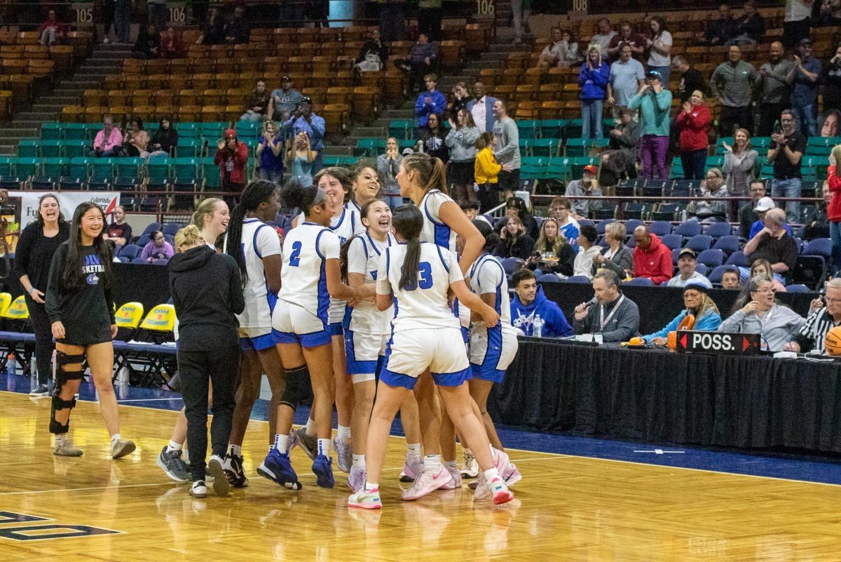 Grandview Wolves girls basketball team celebrating clinching championship berth at the Denver Coliseum on March 13th.