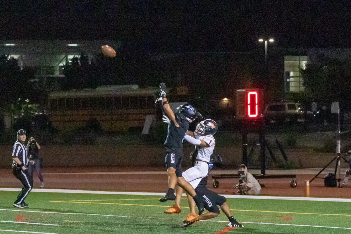 Jaxson Flores leaping into the air to intercept a pass from Legend on august 30, 2024. 