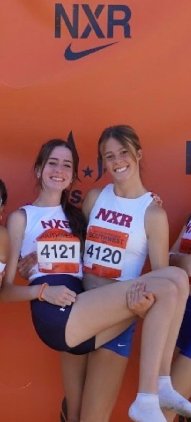 Emerson Hensler (11) holds up Maria Hiatt (11) after competing at NXR in Arizona 