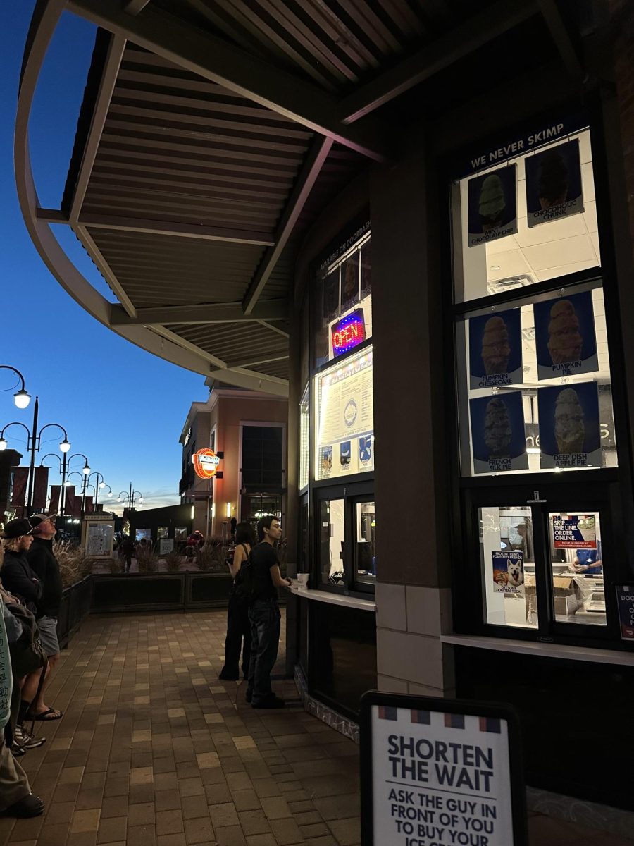 Customers line up outside Handel’s at Southlands as the last bit of daylight fades, waiting for late-night ice cream.
