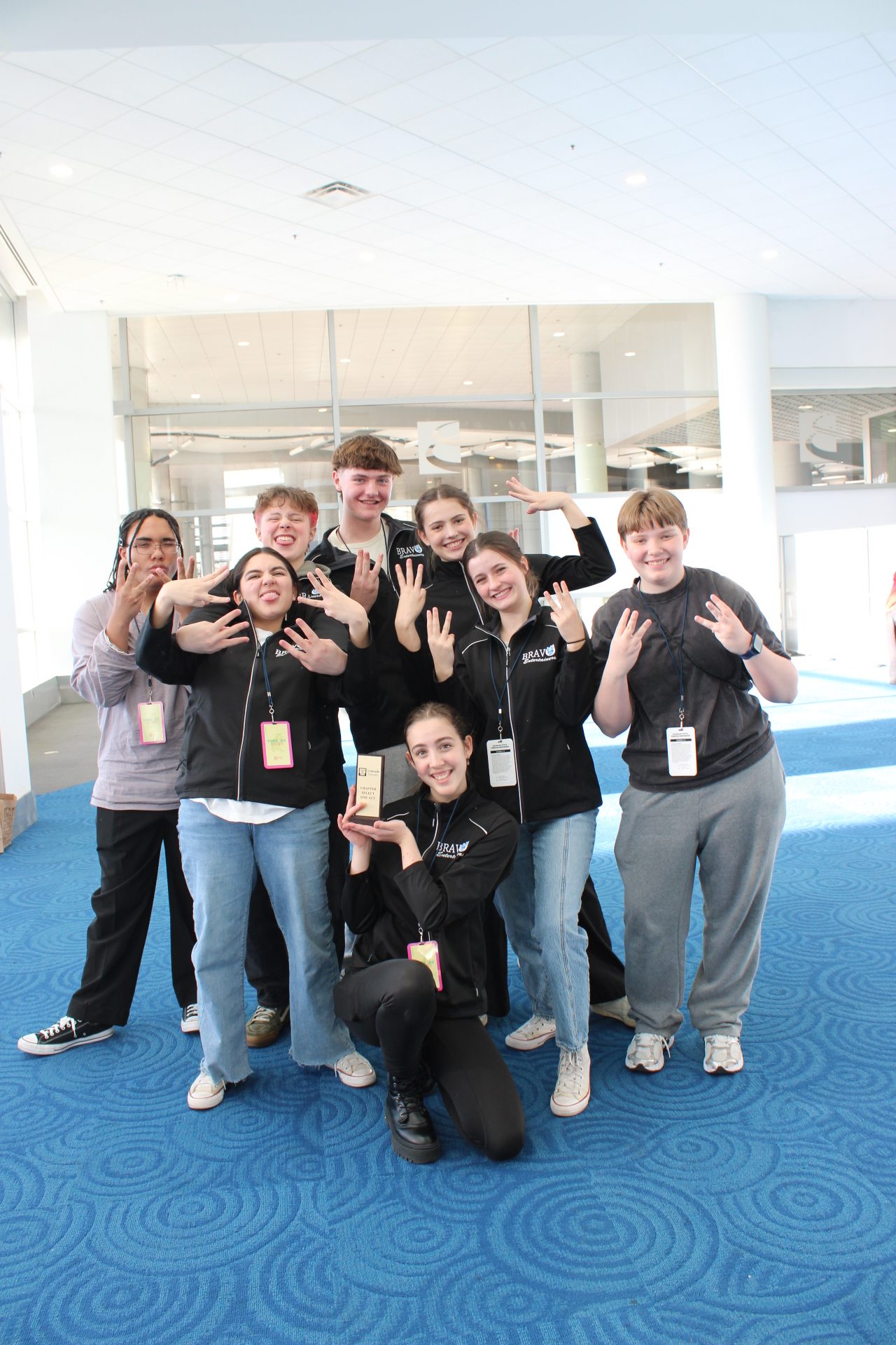 Bravo students posing with their first place trophy.