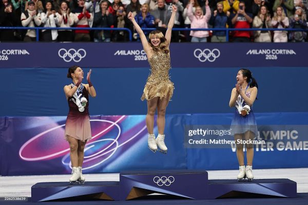 MILAN, ITALY - FEBRUARY 19: Gold medalist Alysa Liu of Team United States celebrates on the podium during the medal ceremony for the Women's Single Skating on day thirteen of the Milano Cortina 2026 Winter Olympic games at Milano Ice Skating Arena on February 19, 2026 in Milan, Italy. (Photo by Matthew Stockman/Getty Images)