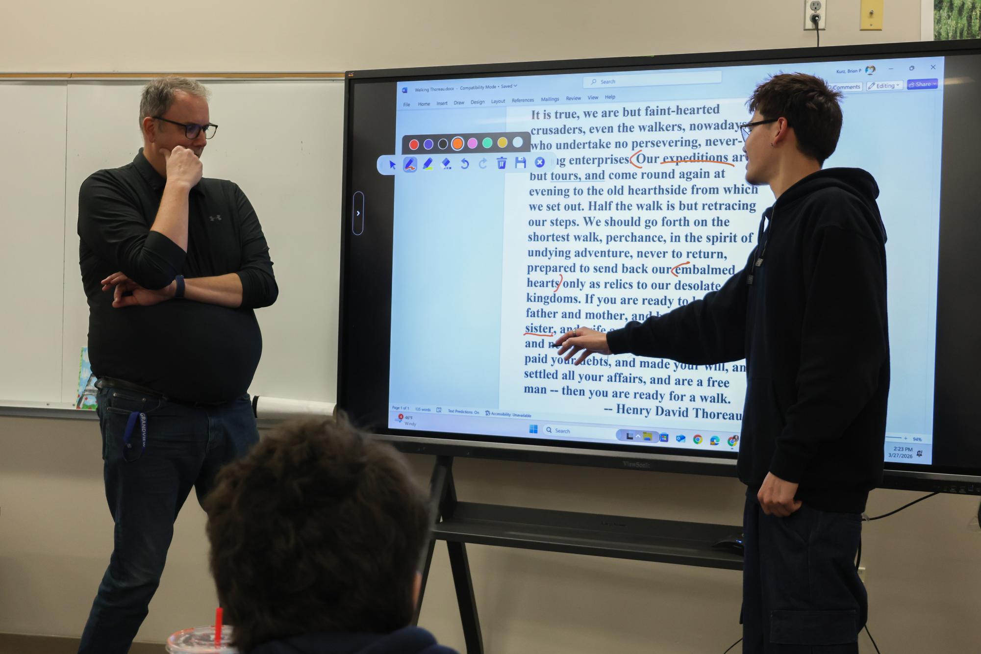 Mr. Kurz (English) uses the IFP for a more interactive learning style in his classroom, analyzing a Thoreau poem.