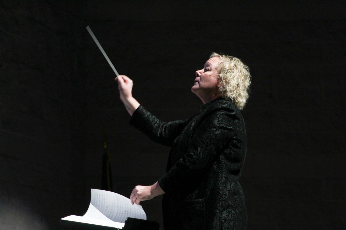 Mindi Loewen (Orchestra) conducts the orchestra.