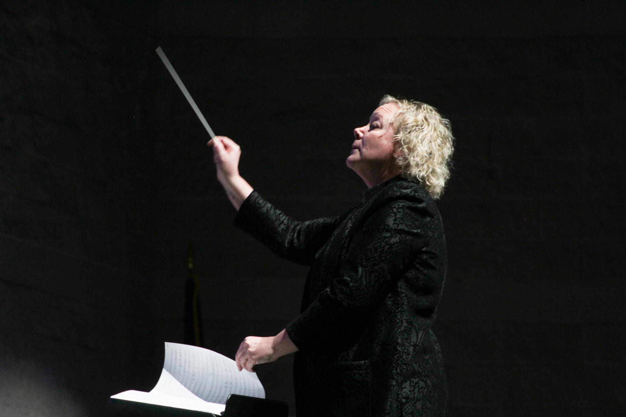 Mindi Loewen (Orchestra) conducts the orchestra.