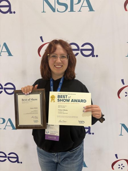 Chelsea Wilhelm (11) shows off her Best of Show award.